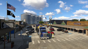American Truck Simulator South Dakota – offizieller SCS-Screenshot eines Ortes mit Lastwagen und Getreidesilos