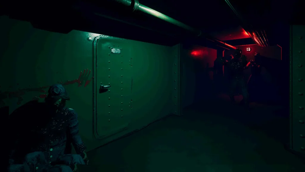 A narrow submarine corridor with green and red light, with figures standing in the darkness.