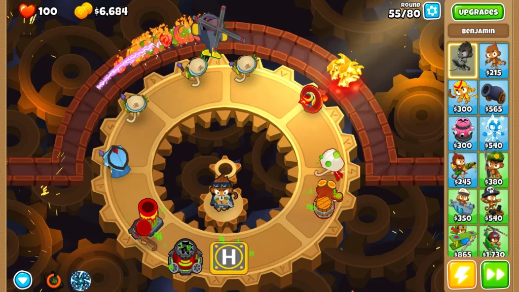 A game situation in Bloons TD 6 with bloons and monkey towers