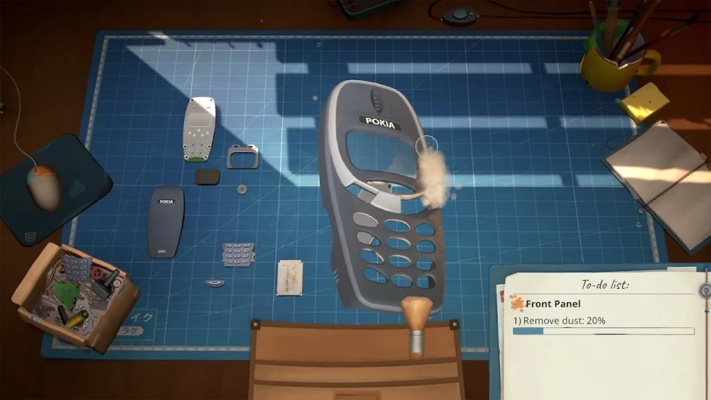 A disassembled phone lies on the blue repair mat in ReStory.