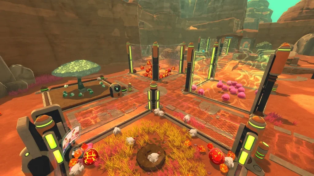 Mehrere Slimes stehen in Gehegen auf der Ranch aus Slime Rancher.