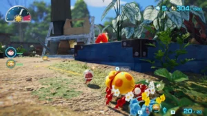 Spielfigur und Rettungshund Otschin laufen mit roten Pikmin durch einen Garten mit Beeten.