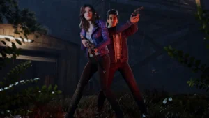 Zwei Figuren in Evil Dead: The Game bereiten sich auf den Kampf gegen Untote vor.